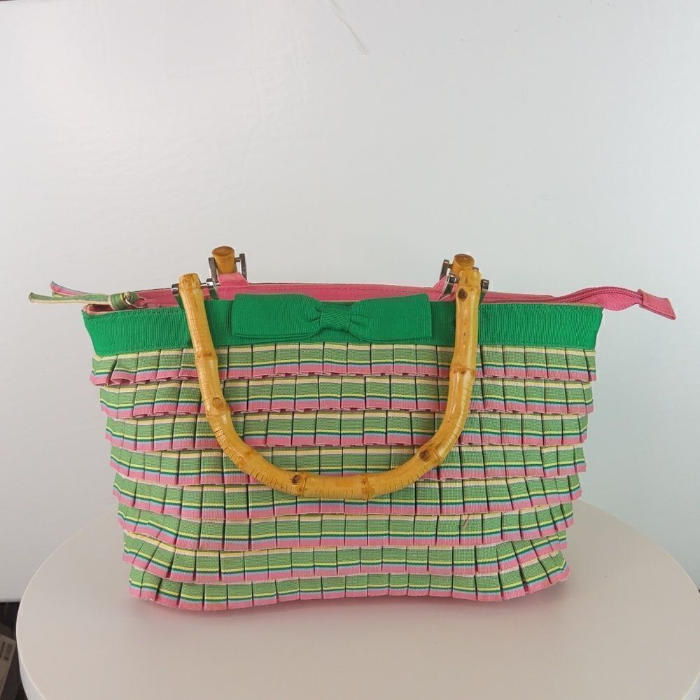 And pink plaid ruffled zip top handbag with faux w